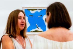 Two people chat at the opening reception for the Luchita Hurtado: Earth & Sky Interjected exhibition at the Harwood Museum on Friday (July 26). DANIEL PEARSON/Taos News